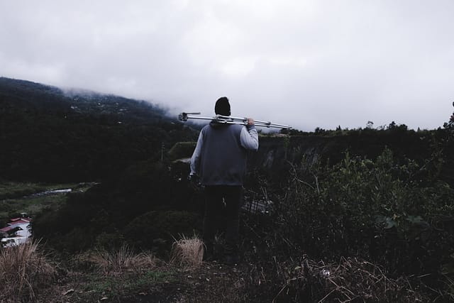 carrying a tripod